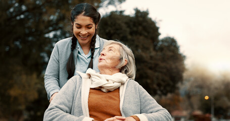 Senior woman, talking and outdoor with caregiver, nurse or healthcare service for person with a...