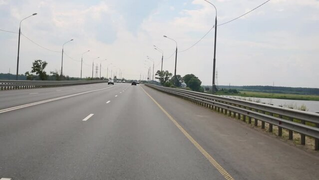 Road from Tver to Moscow near water of Volga river from windows 