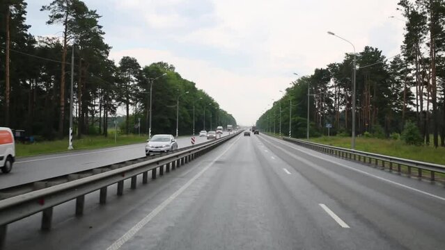 Road from Tver to Moscow from windows of moving car at day