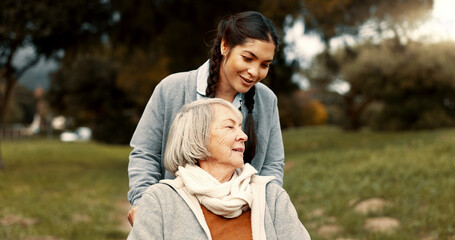 Senior woman, talking and outdoor with caregiver, nurse or healthcare service for person with a...