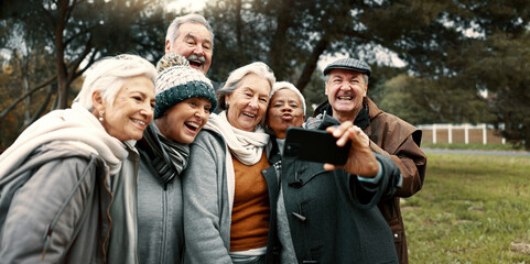 Excited, selfie and group of senior friends in outdoor green environment for fresh air. Diversity, happy and elderly people in retirement taking picture together while exploring and bonding in a park