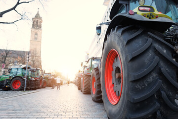 Farmers union protest strike against government Policy in Germany Europe. Tractors vehicles blocks city road traffic. Agriculture farm machines Magdeburg central Domplatz square - obrazy, fototapety, plakaty