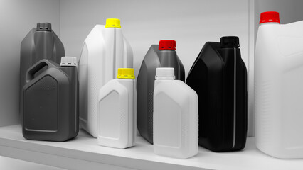 Multi-colored plastic canisters for various liquids on a shelf