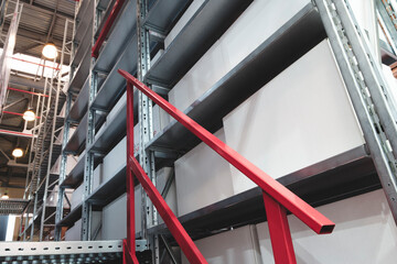 Naklejka premium modern distribution warehouse with boxes on racks