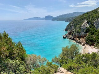 Sardinia beach blue and turquoise with cliff