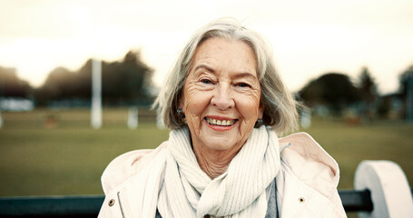 Face, senior woman and smile on park bench on vacation, holiday or travel in winter. Portrait,...
