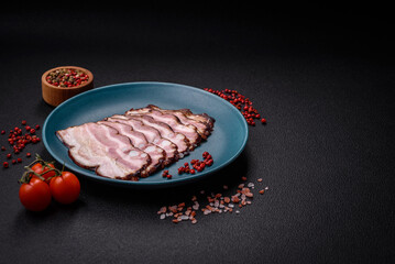 Delicious fresh pancetta or bacon with salt and spices cut into thin slices