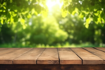 Fototapeta premium Wooden table and blurred green nature garden background. Old empty wooden table - green spring background