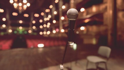 An Intimate Opera Performance on an Empty Stage with Microphone and Chairs