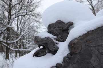 Statue of a Chinese dragon under the snow
