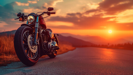 A motorcycle parked along a street at sunset