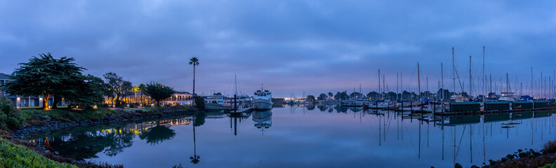 Panoramic view of beatiful marina during the early sunrise hours with San Francisco buildings on the background