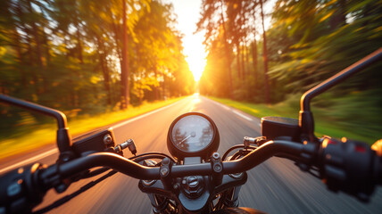 A motorcycle speeds on a road between trees at sunset, motorcyclist's point of view