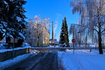 Industrial chimney at Stražišče, Kranj in Gorenjska, Slovenia in winter