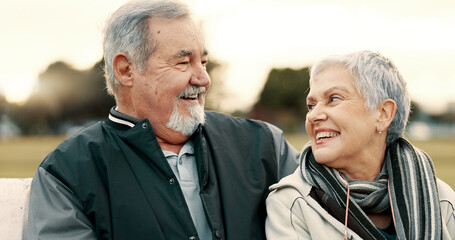 Face, love and smile with a senior couple outdoor in a park together for a romantic date during...