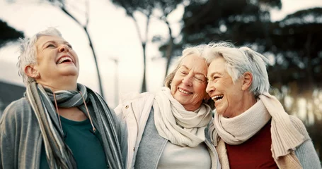 Deurstickers Comedy, laughing and senior woman friends outdoor in a park together for bonding during retirement. Portrait, smile and funny with a happy group of elderly people bonding in a garden for humor or fun © Clement C/peopleimages.com