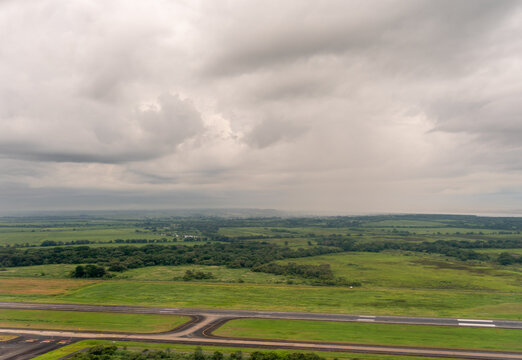 Aerial View of Landing Runway in Panama city with cloudy skies