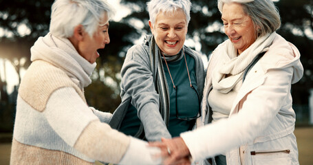 Fitness, park or senior women in huddle, training or exercise for wellness, solidarity or teamwork outdoors. Happy ladies, group success or elderly friends raising arms for workout support together