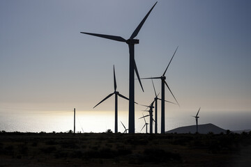 Lanzerote, Spain - December 24, 2023: Wind turbines in silhouette on the island of Lanzerote in...