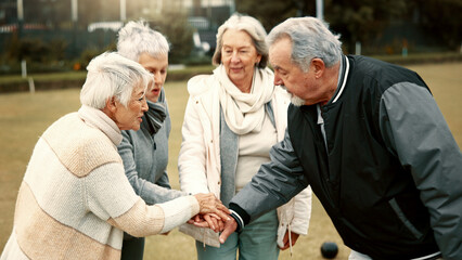 Hands, motivation and senior friends in a huddle outdoor for support, celebration or unity during a...