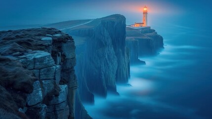  a long exposure photo of a lighthouse on the edge of a cliff with a body of water in the foreground.