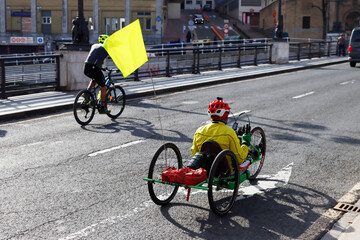 Hand bicycle rider in the street