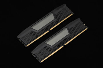 Two computer memory modules on a black background