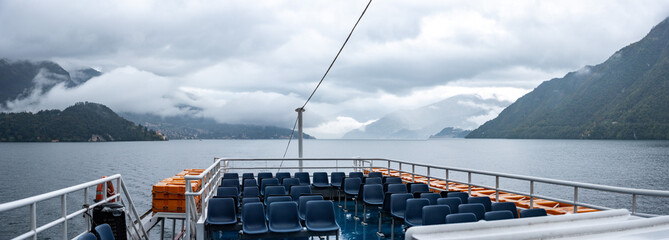 An empty ferry during rainy weather on lake Como