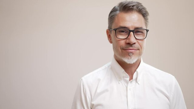 Middle age businessman in white business shirt. Casual entrepreneur. Portrait of mid adult, mature age man, happy smiling. Isolated on white, copy space.