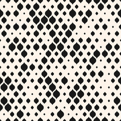 Black and white vector seamless pattern with small curved shapes, drops, dots. Stylish modern background with halftone effect, randomly scattered shapes. Simple elegant texture. Trendy geo design