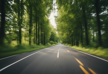 Fototapeta na wymiar Empty asphalt road and speed motion blur on highway in summer with green trees forest at countryside
