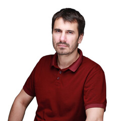 A picture of a man with a beard, mustache and fashionable hairstyle, dressed in a casual polo shirt, posing in a studio with a serious expression on a light background