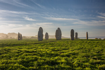 Misty Dawn at Coruna: The Menhirs' Silent Vigil