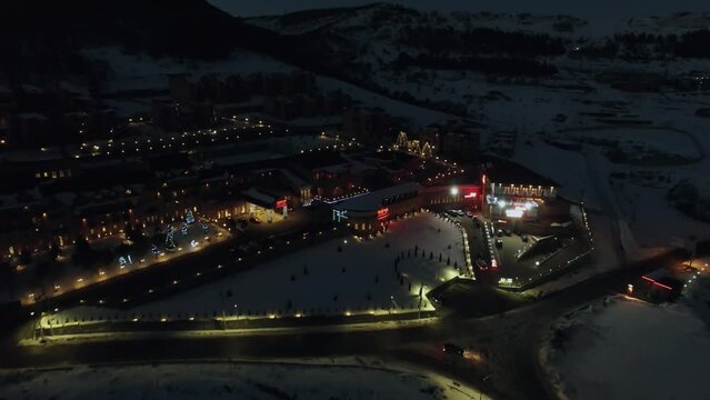 Complex of Marriott hotel with illumination near mountains