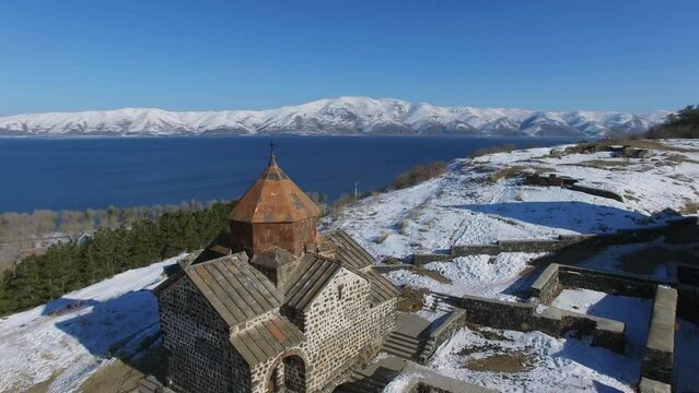 Sevanavank monastic complex on hill near Sevan Lake at winter 