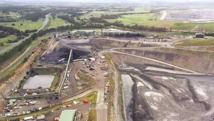 Over black coal mine in Hunter valley of Australia near Singleton – machinery 4k.
