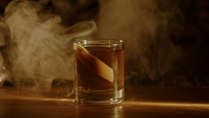 Old fashioned cocktail and smoke