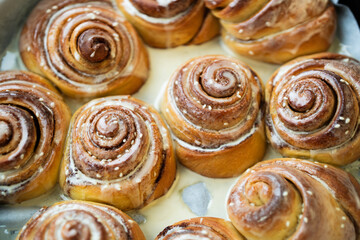 Cinnabon. Homemade glazed buns with sesame and cinnamon. delicious pastries or a warm roll.