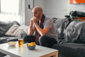 Young boy watching sports at home
