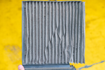 Closed up filthy car's air conditioning filter that needs to be replaced.
