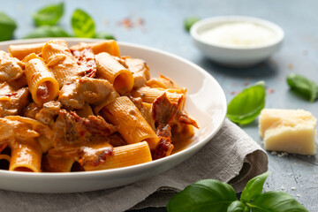 Gochujang Pasta with chicken, sun dried tomatoes and pecorino cheese.