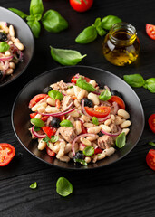 White bean tuna salad with olive, red onion, tomatoes. Healthy food