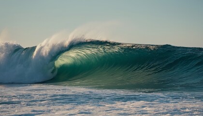 The sea wave is illuminated by the sun's rays, against the backdrop of a clear sky. For art, advertising of goods or services related to the sea or beach