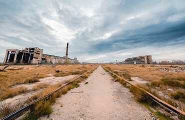 Abandoned factories on a road to a dystopian future