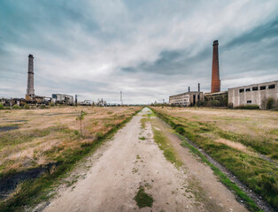 Abandoned factories on a road to a dystopian future