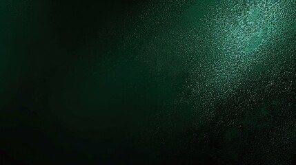 Obraz premium Dark green color gradient grainy background, illuminated spot on black, noise texture effect, wide banner size.