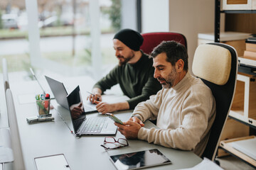 Professional men working together in a modern office environment.