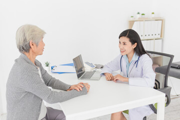 close up doctor, Asian doctor talk with old female patient about disease symptom in hospital, elderly health check up, happiness hospital