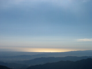 View of sunset in the San Gabriel Mountains of Los Angeles County, California. Strawberry Peak trail. Beautiful sky and range landscape panorama.