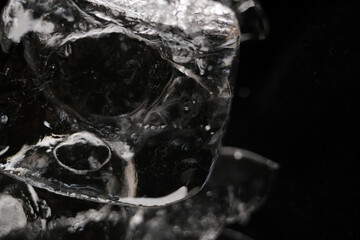 Macro shot of ice cube texture. Ice is less dense than liquid water allowing it to float in water